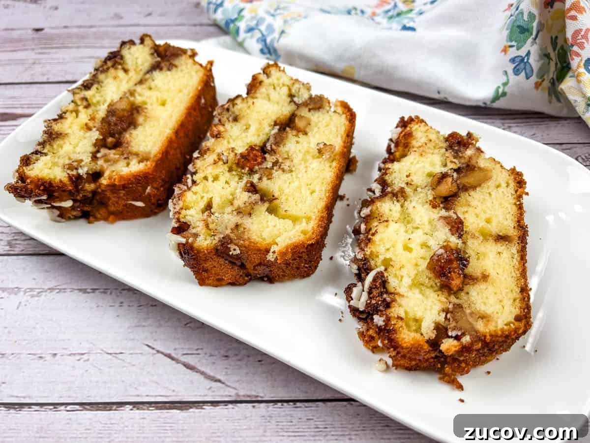 33 Irresistible Fall Desserts That Defy Portion Control 31 Three slices of apple fritter bread on a white plate.