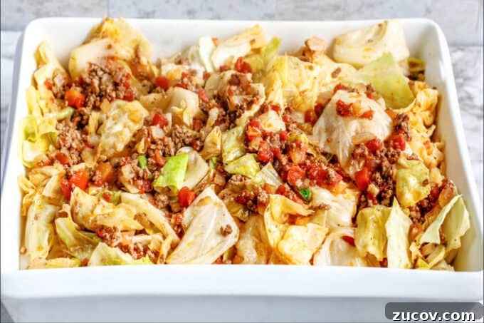 Unstuffed Cabbage Roll Casserole Recipe – One-Pan Comfort Meal 7 dish full of ingredients for meal.