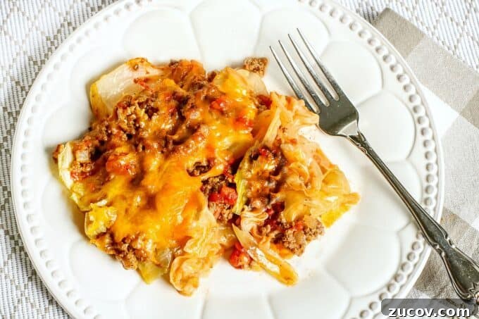 Unstuffed Cabbage Roll Casserole Recipe – One-Pan Comfort Meal 9 dinner on plate with fork.