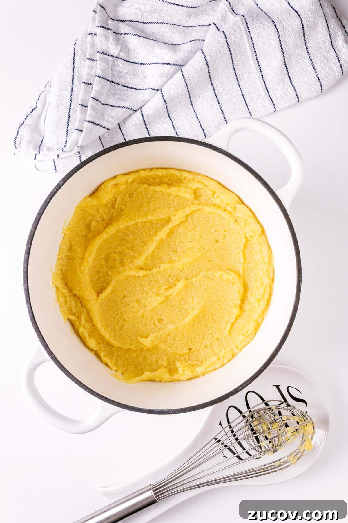 Creamy Polenta with Caramelized Onions and Sautéed Peppers 5 Creamy cooked polenta in a pot.