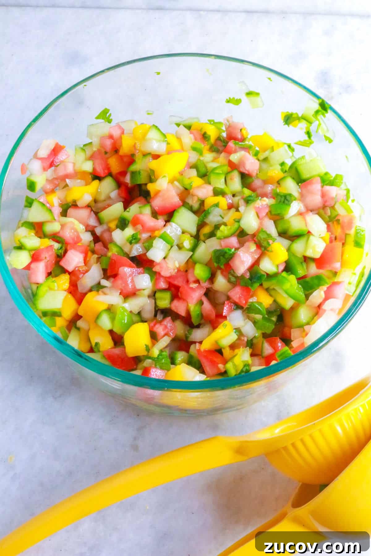 Tropical pico de gallo in a glass bowl