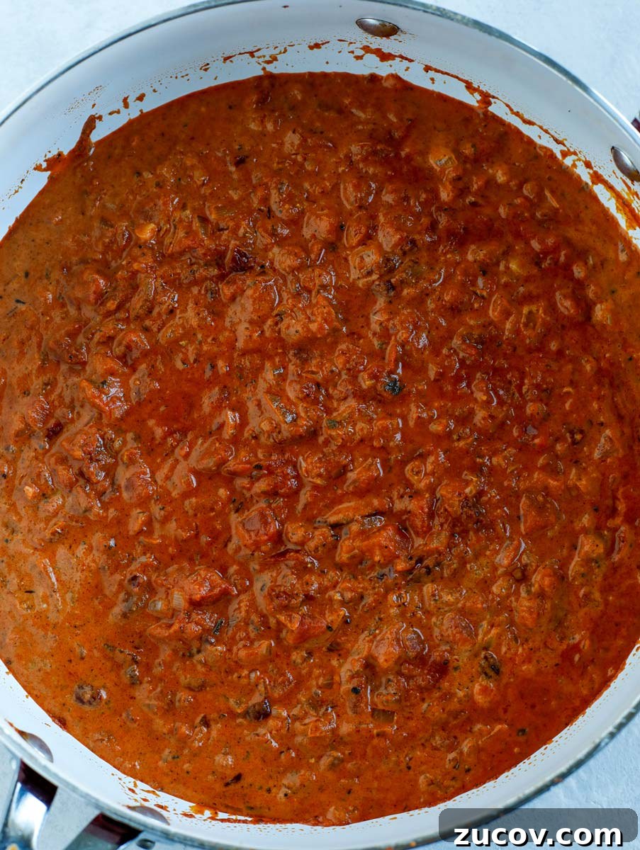 Creamy Spicy Shrimp Pasta with Garlic and Chili Oil 3 Top down shot of spicy pasta sauce in a skillet.