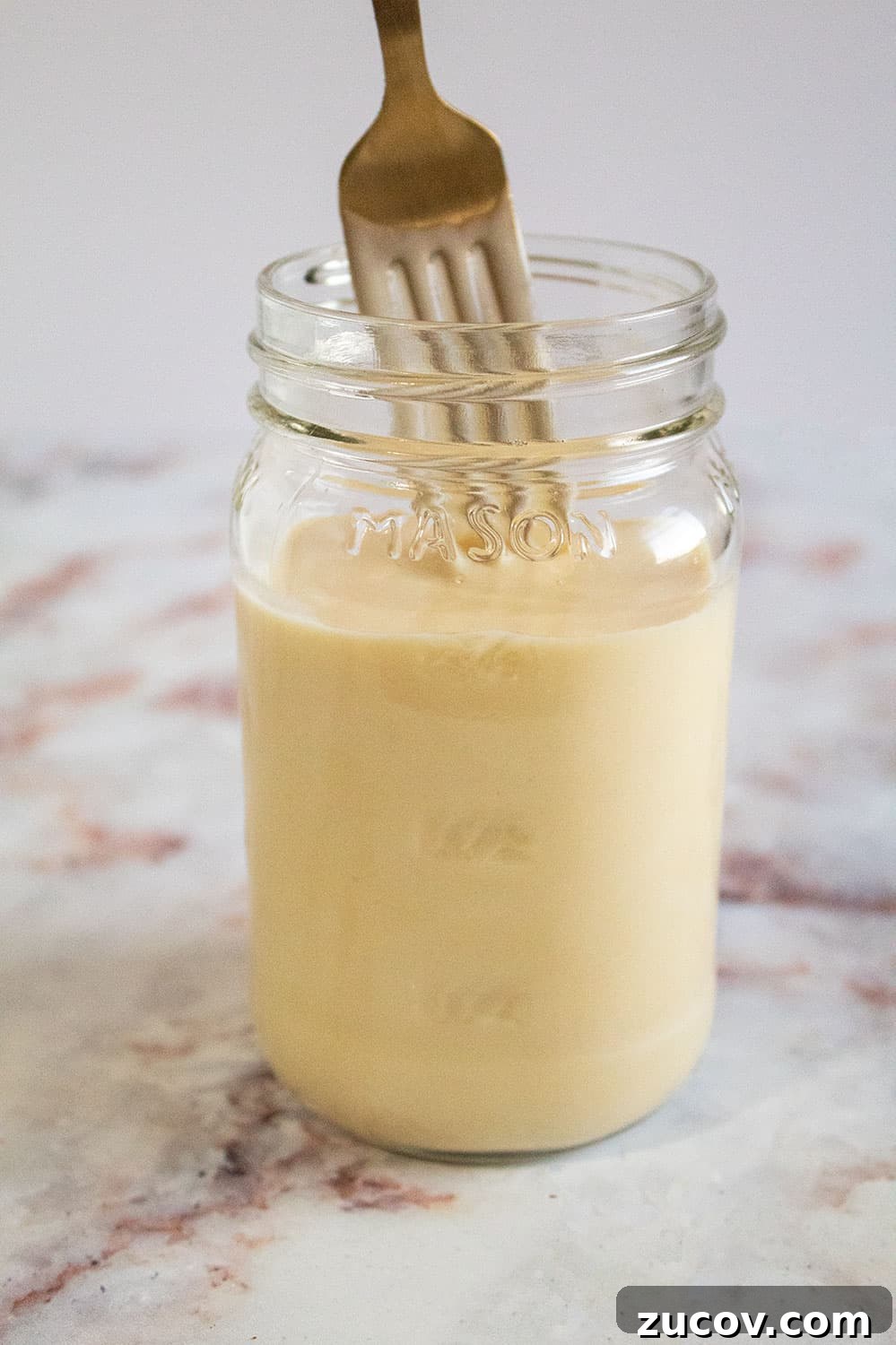Keto Peanut Butter Chocolate Chip Cookie Recipe 18 jar of keto condensed milk with fork in it