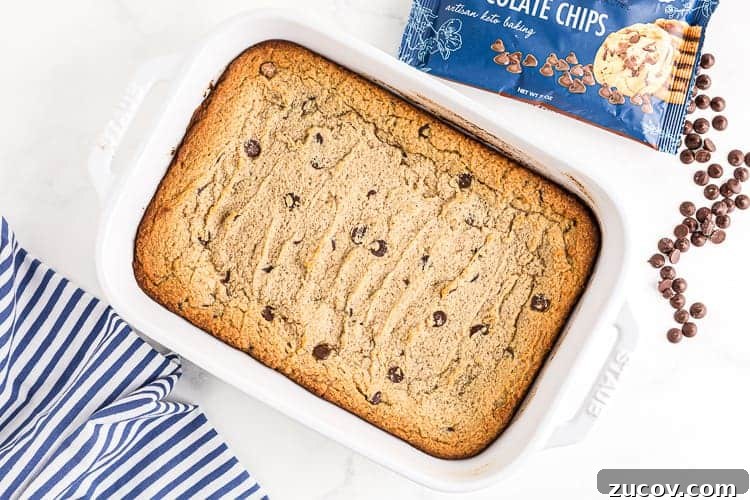 Keto Peanut Butter Chocolate Chip Cookie Recipe 5 overhead view of baked keto cookie casserole with chocolate chips
