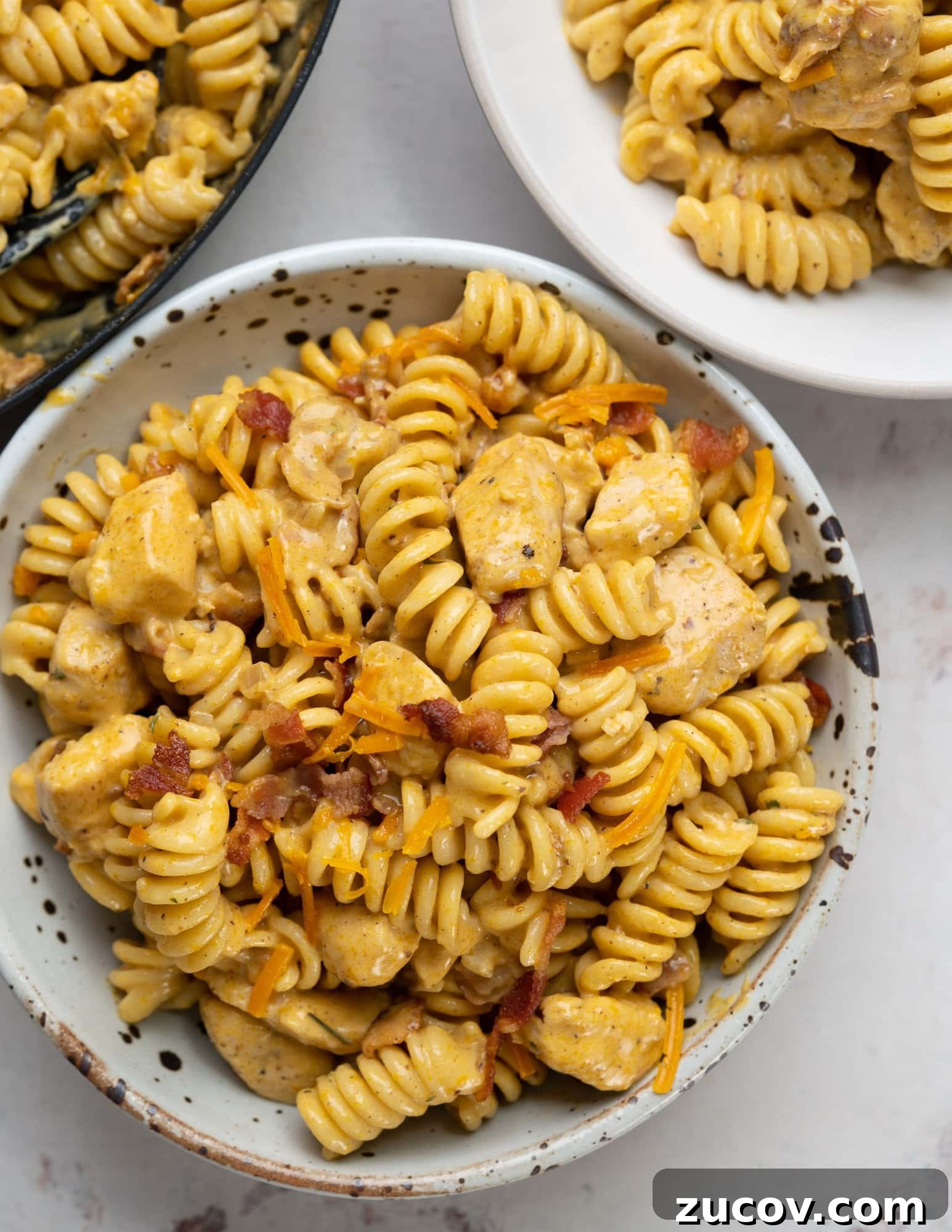 Creamy Chicken Bacon Ranch Pasta Recipe for Weeknight Dinners 4 Chicken pasta with ranch seasoned sauce and bacon served in a bowl