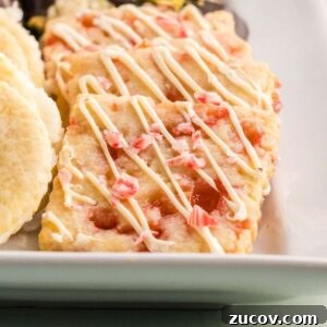 Peppermint Shortbread Cookies with White Chocolate Drizzle Recipe 11 Close-up of peppermint shortbread cookies with drizzled white chocolate.