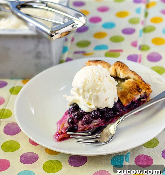 Sour Cream Peach Pie Ice Cream Recipe: Creamy Summer Dessert 4 A slice of berry galette with peach ice cream.