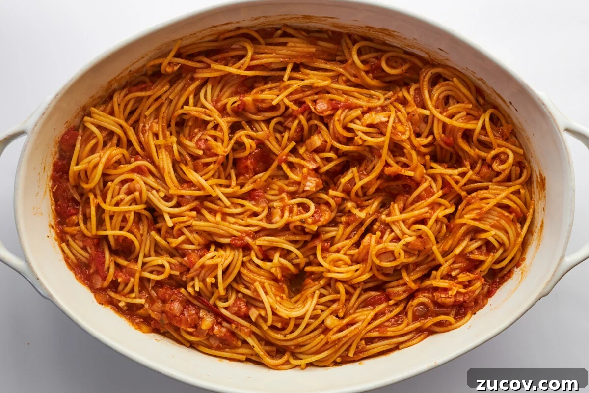 Cheesy Oven-Baked Spaghetti Casserole Recipe 14 Baked spaghetti in an oval baking dish.