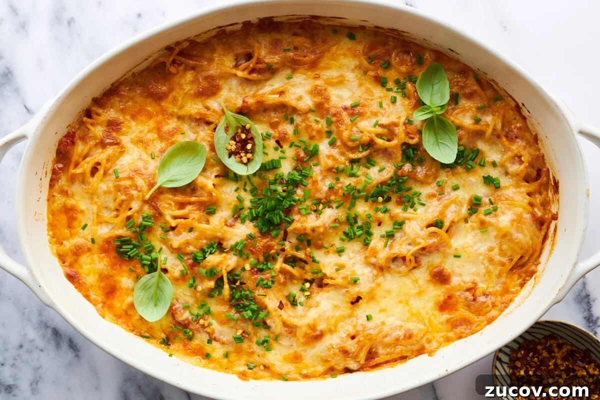 Cheesy Oven-Baked Spaghetti Casserole Recipe 15 Oven baked spaghetti topped with cheese.