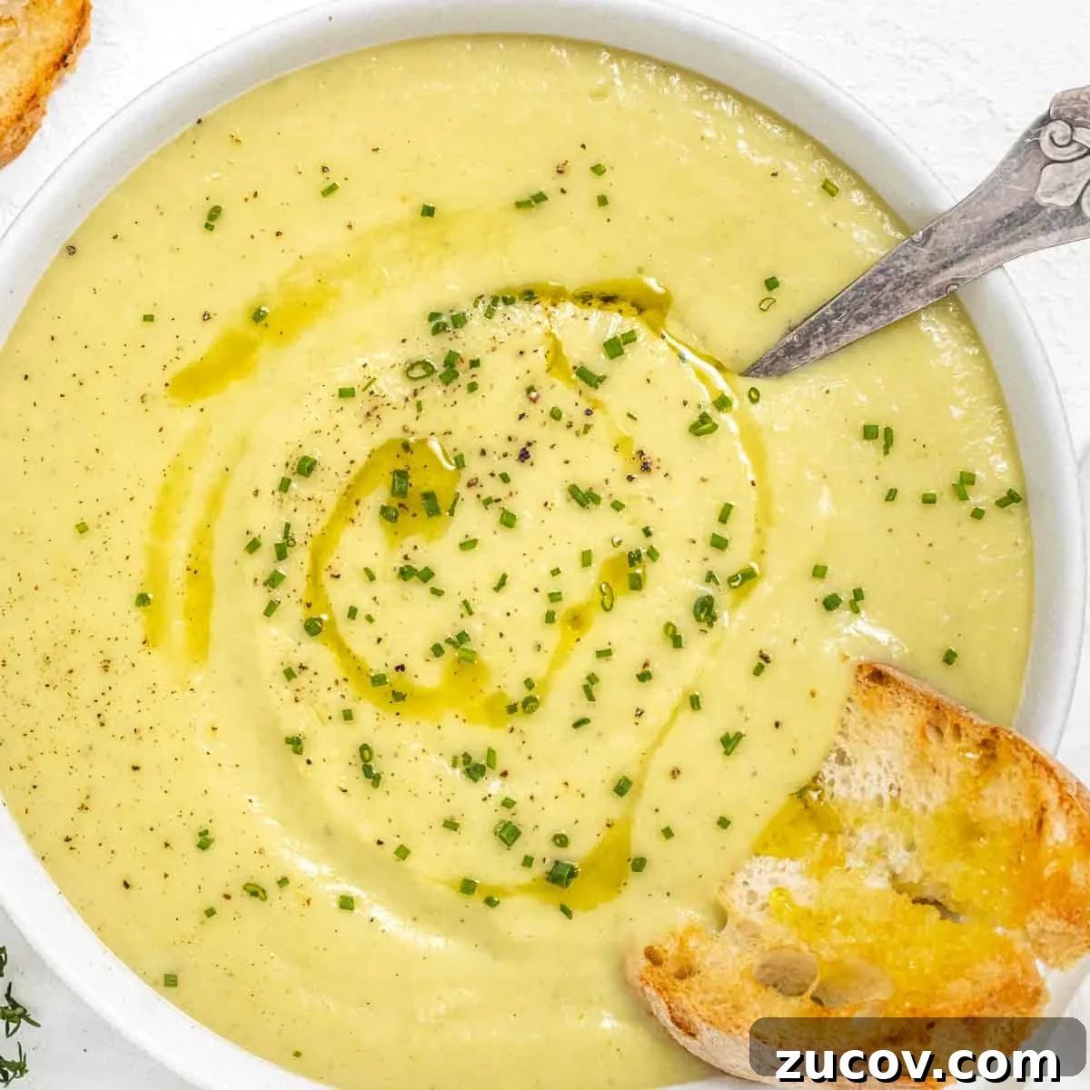 25 Affordable Recipes That Taste Gourmet on a Budget 12 Potato leek soup with silver spoon