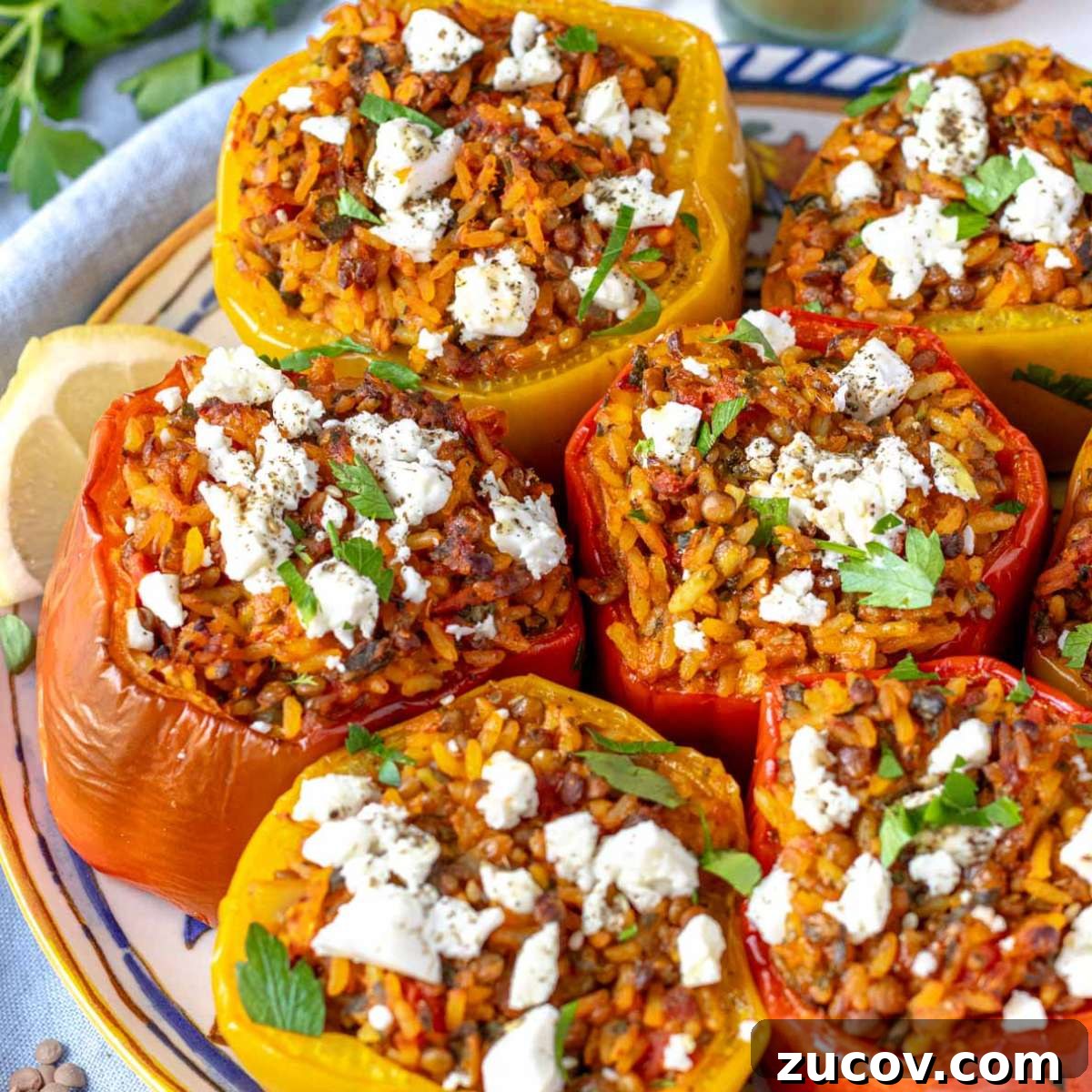 25 Affordable Recipes That Taste Gourmet on a Budget 15 Oven-baked Mediterranean stuffed bell peppers filled with rice, lentils, and herbs, served as a wholesome and colorful vegetarian main dish.
