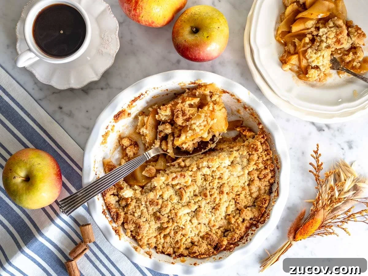 25 Affordable Recipes That Taste Gourmet on a Budget 19 Apple crumble in pie dish and a cup of coffee