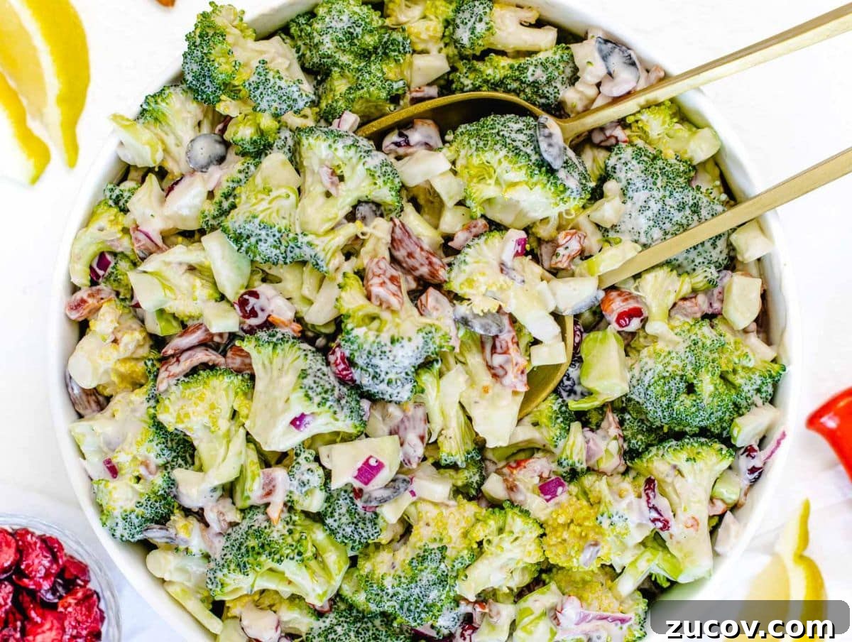 25 Affordable Recipes That Taste Gourmet on a Budget 22 Healthy broccoli salad with Greek yogurt dressing served in a white bowl.