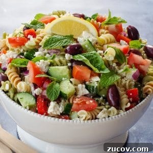 Greek Pasta Salad for Potlucks: Fresh Mediterranean Recipe 15 Greek pasta salad in white bowl