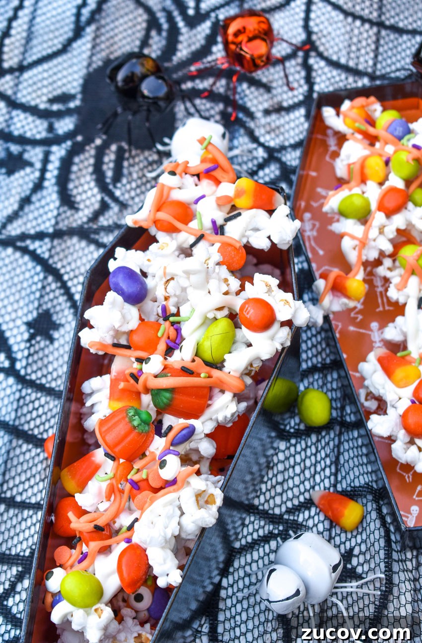 Monster Munch Snacks: Flavor Guide, Variants & Where to Buy 2 monster munch popcorn mix in a coffin shaped treat container