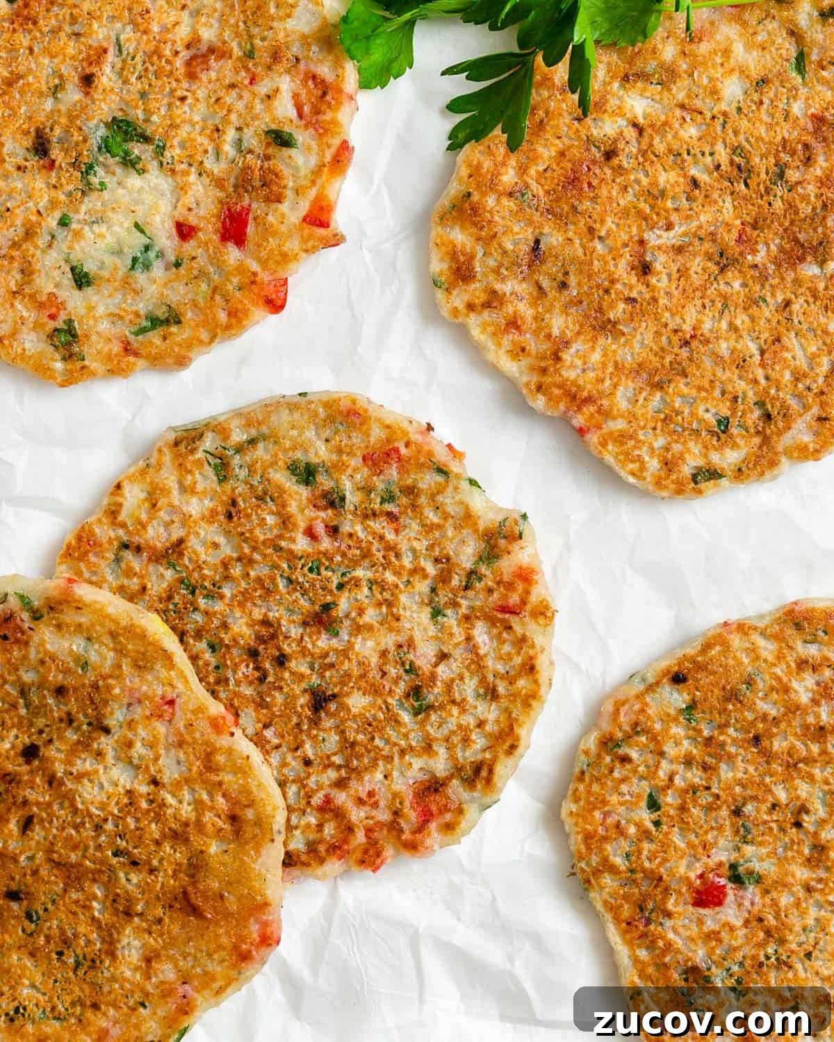 Crispy Vegan Potato Pancakes Recipe for Breakfast & Brunch 11 completed Vegan Potato Pancakes against a white surface