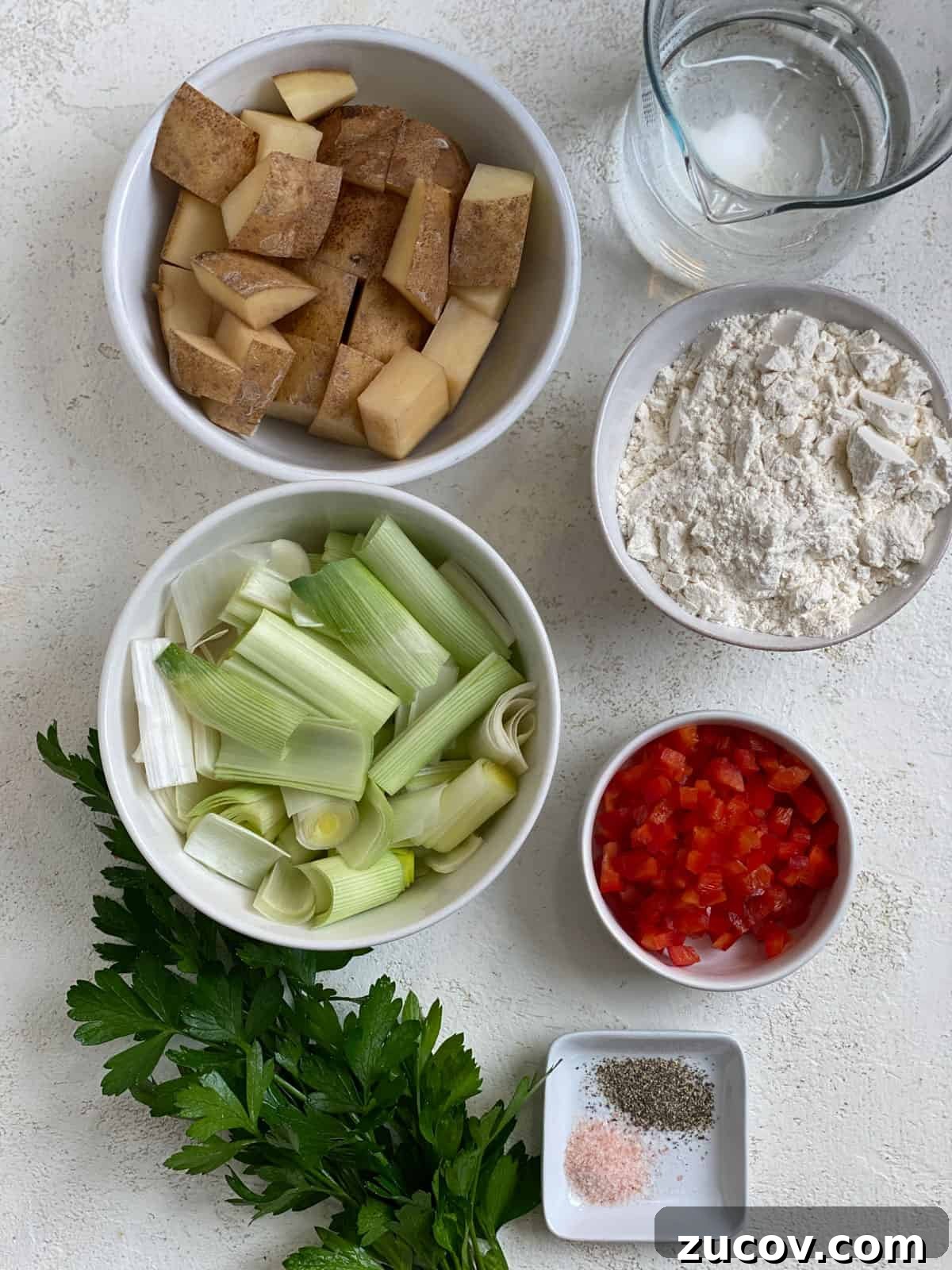 Crispy Vegan Potato Pancakes Recipe for Breakfast & Brunch 3 ingredients for Vegan Potato Pancakes measured out against a white background