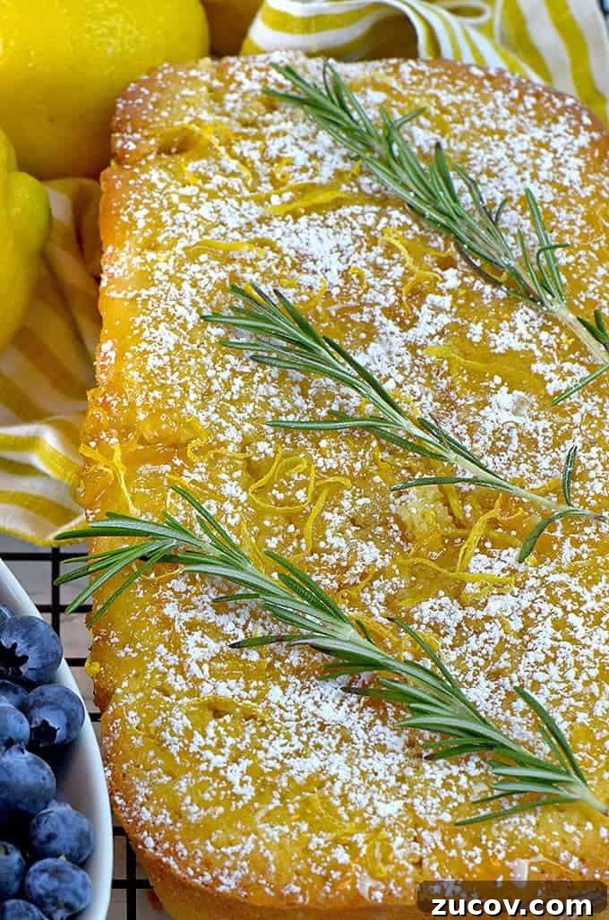 Rosemary Lemon Loaf with Silky Lemon Icing 3 This lemon loaf cake recipe is garnished with sprigs of fresh rosemary.