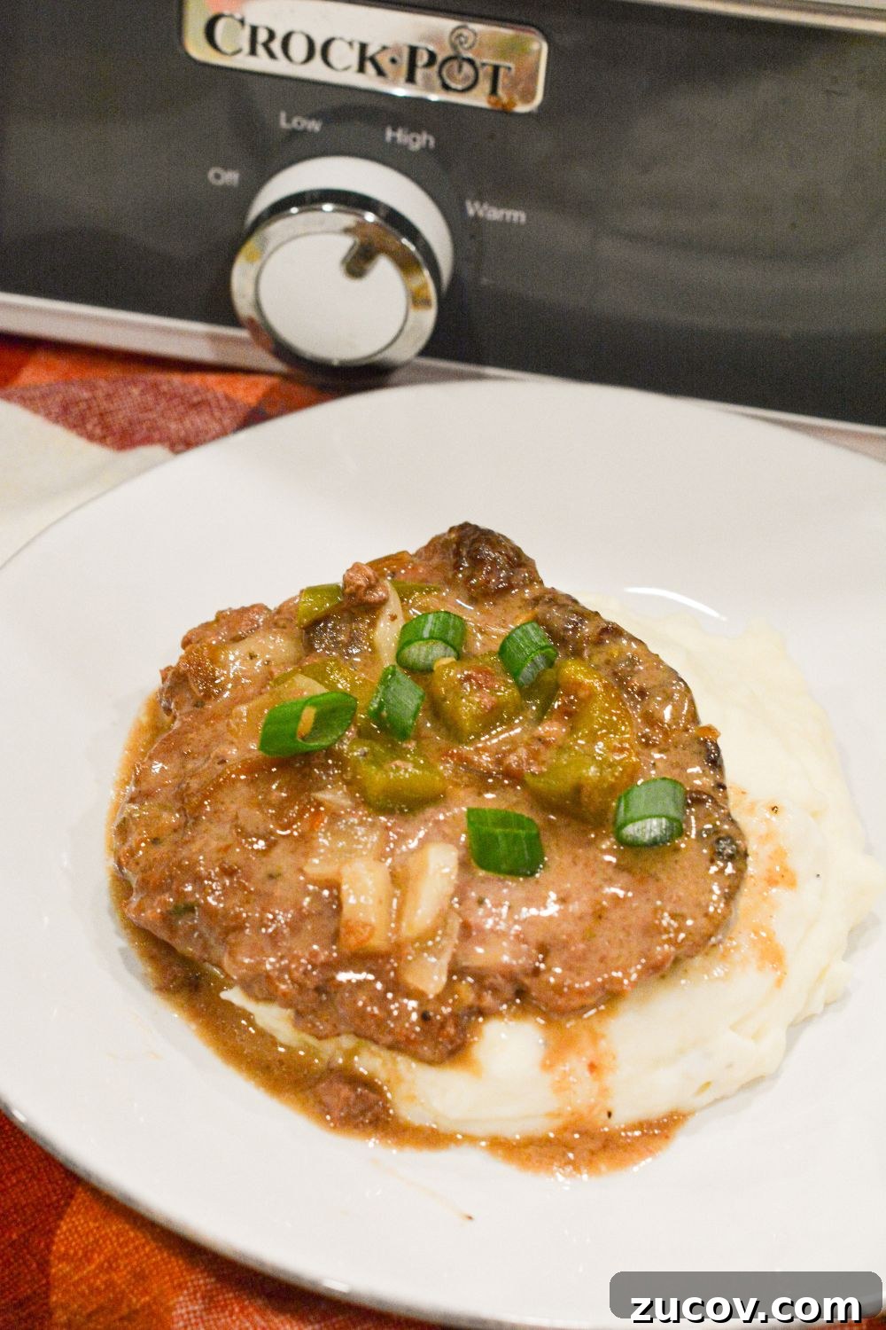 Slow-Cooker Cube Steak in French Onion Gravy 2 Easy Crock Pot Beef Cubed Steaks with Gravy recipe! Tender beef cube steaks cooked in a slow cooker with French onion soup, cream of mushroom soup, and vegetables. Serve over mashed potatoes for a comforting and delicious meal.