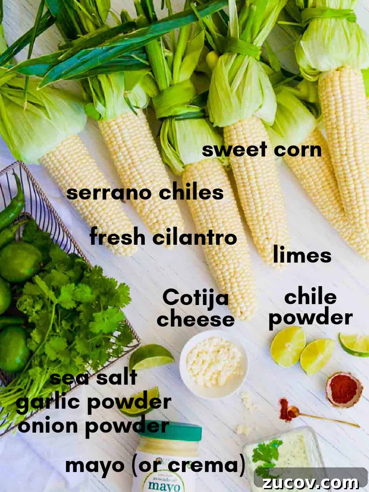 Authentic Mexican Street Corn (Elotes) — Classic Recipe Guide 3 All the ingredients for authentic elotes Mexican street corn on a table all labeled.