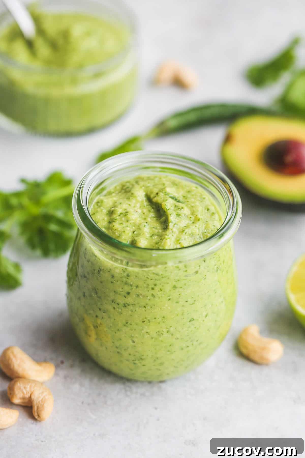 Creamy Avocado Cilantro Dressing Recipe for Salads & Tacos 2 Avocado cilantro dressing in a glass Weck jar.