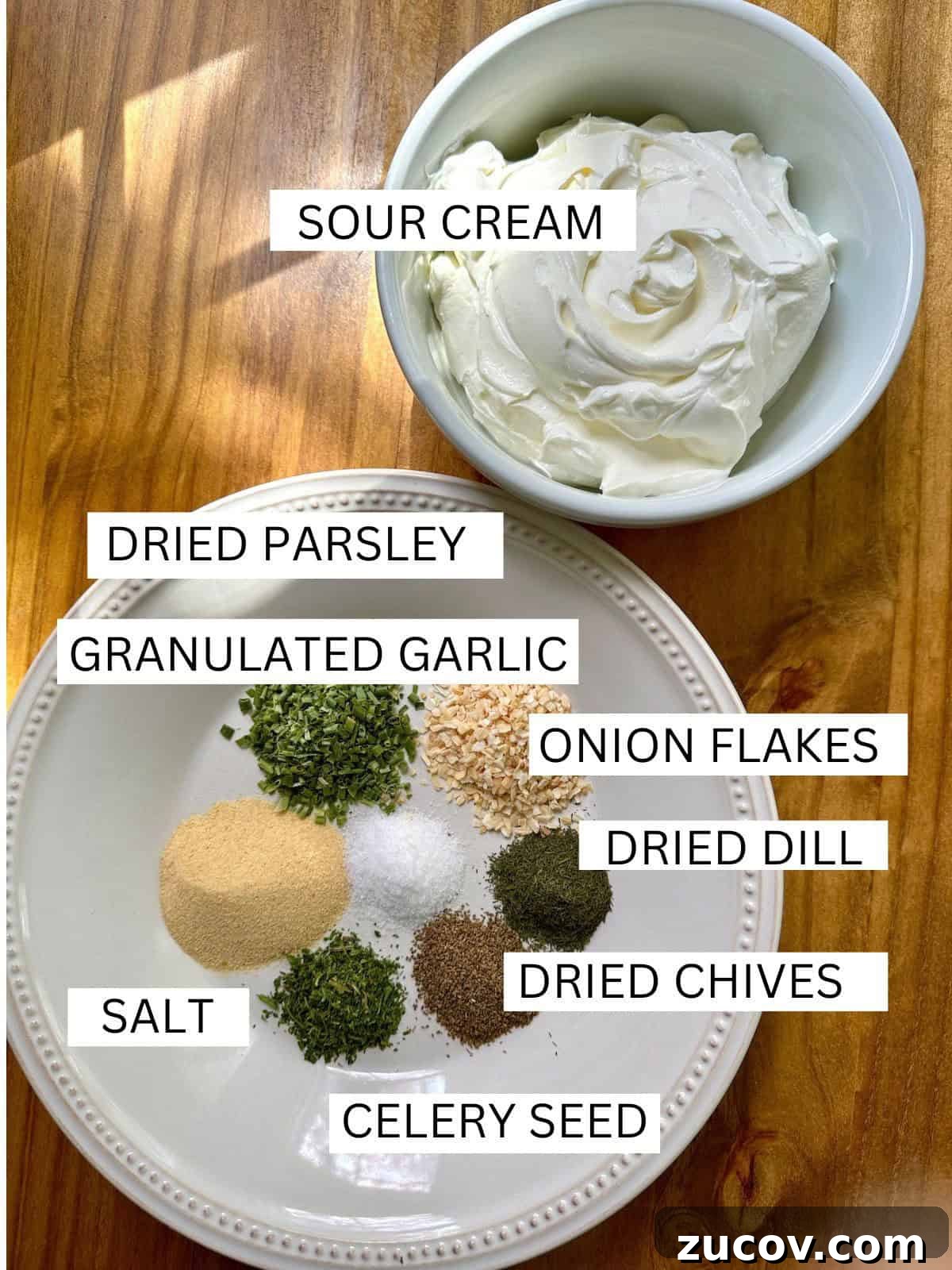 Creamy Herb and Garlic Dip Recipe for Parties and Snacks 3 Ingredients for herb and garlic dip with labels on a table.