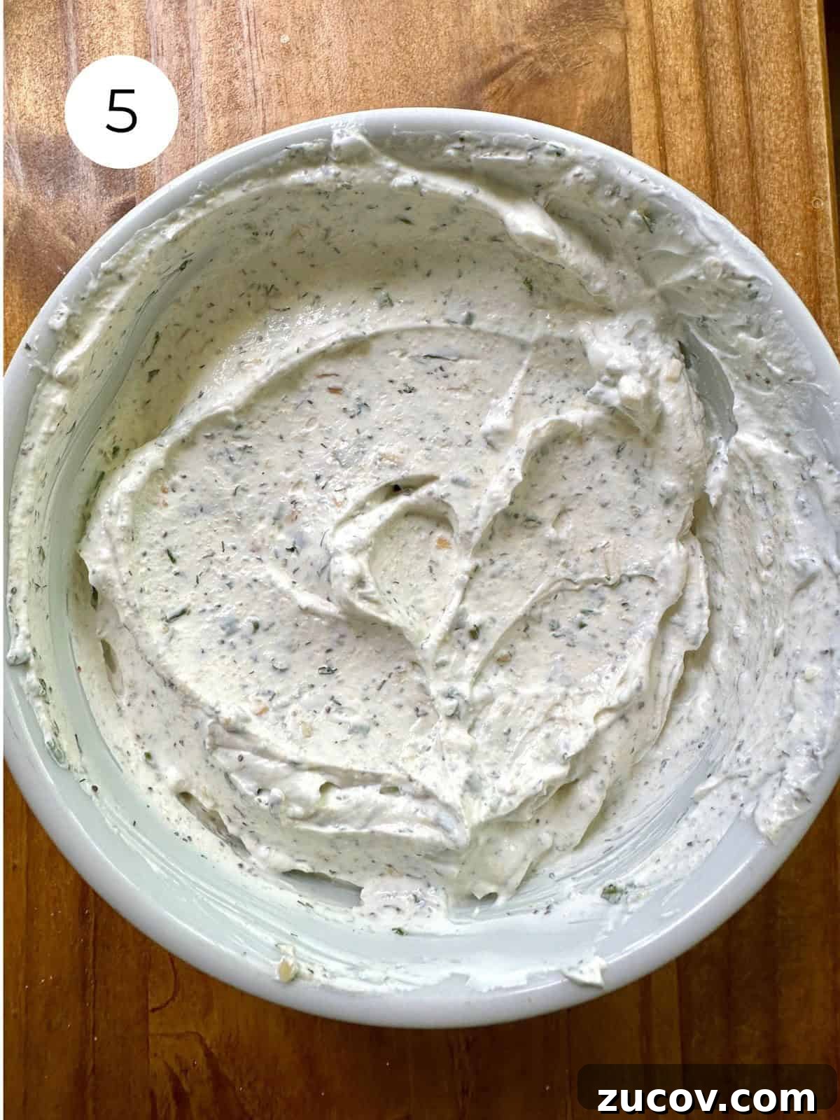 Creamy Herb and Garlic Dip Recipe for Parties and Snacks 8 Blended herb and garlic dip in a bowl.