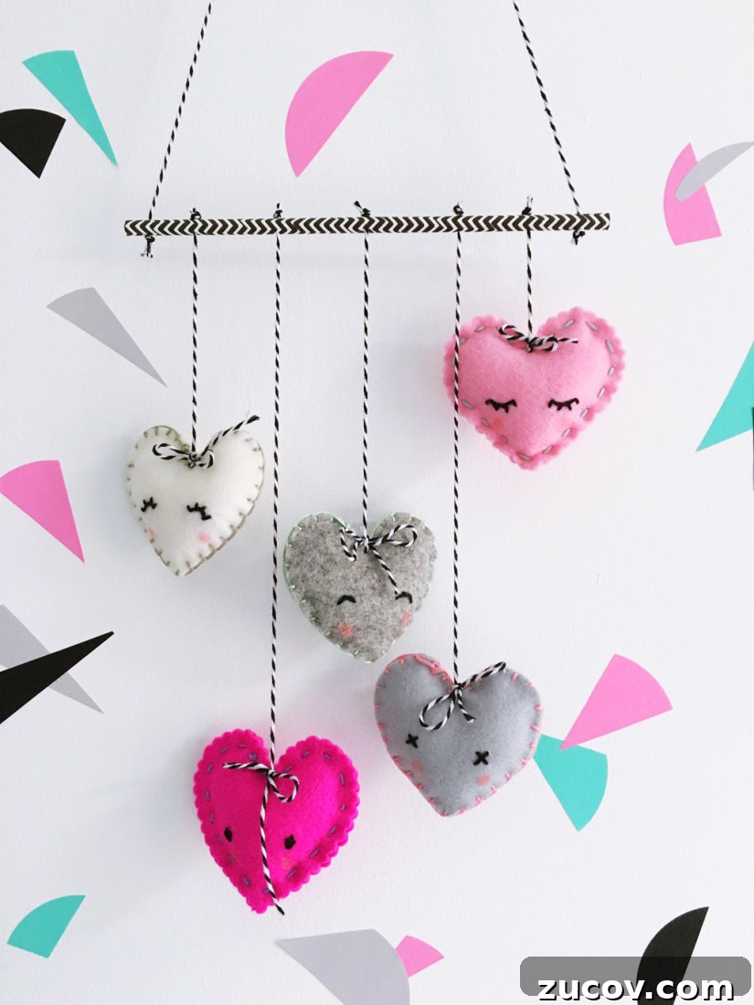 A mobile decorated with multicolored hearts.