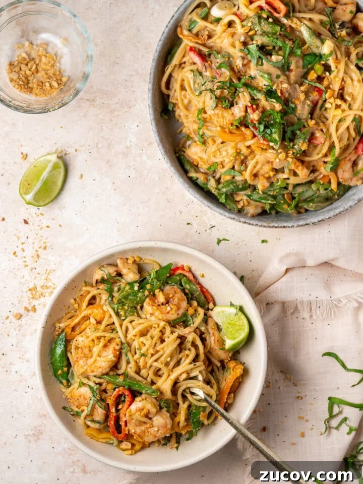 Peanut noodles with shrimp and vegetables tossed in creamy coconut peanut sauce