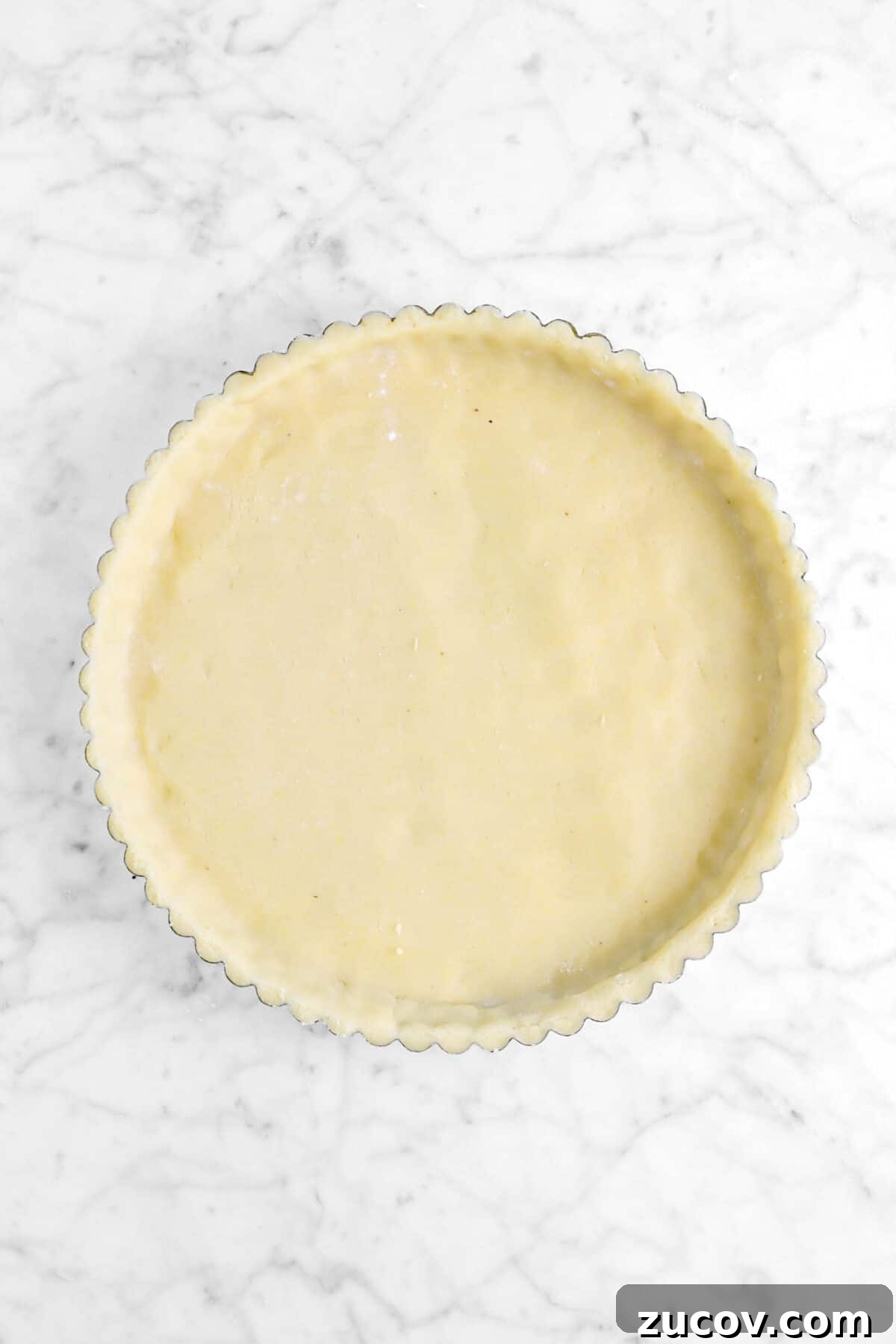 shortbread dough pressed into tart pan