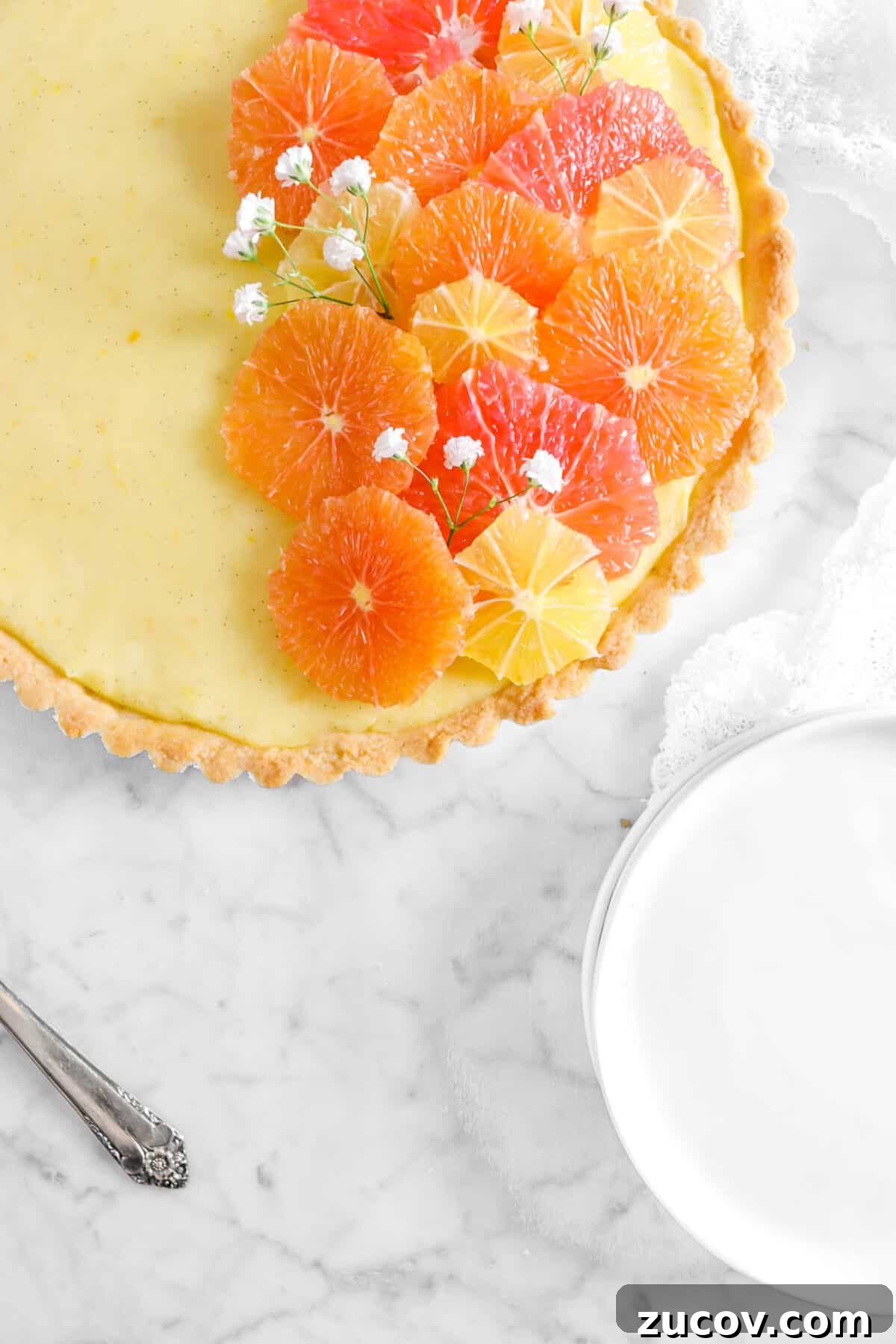 citrus tart in top left corner with white plates