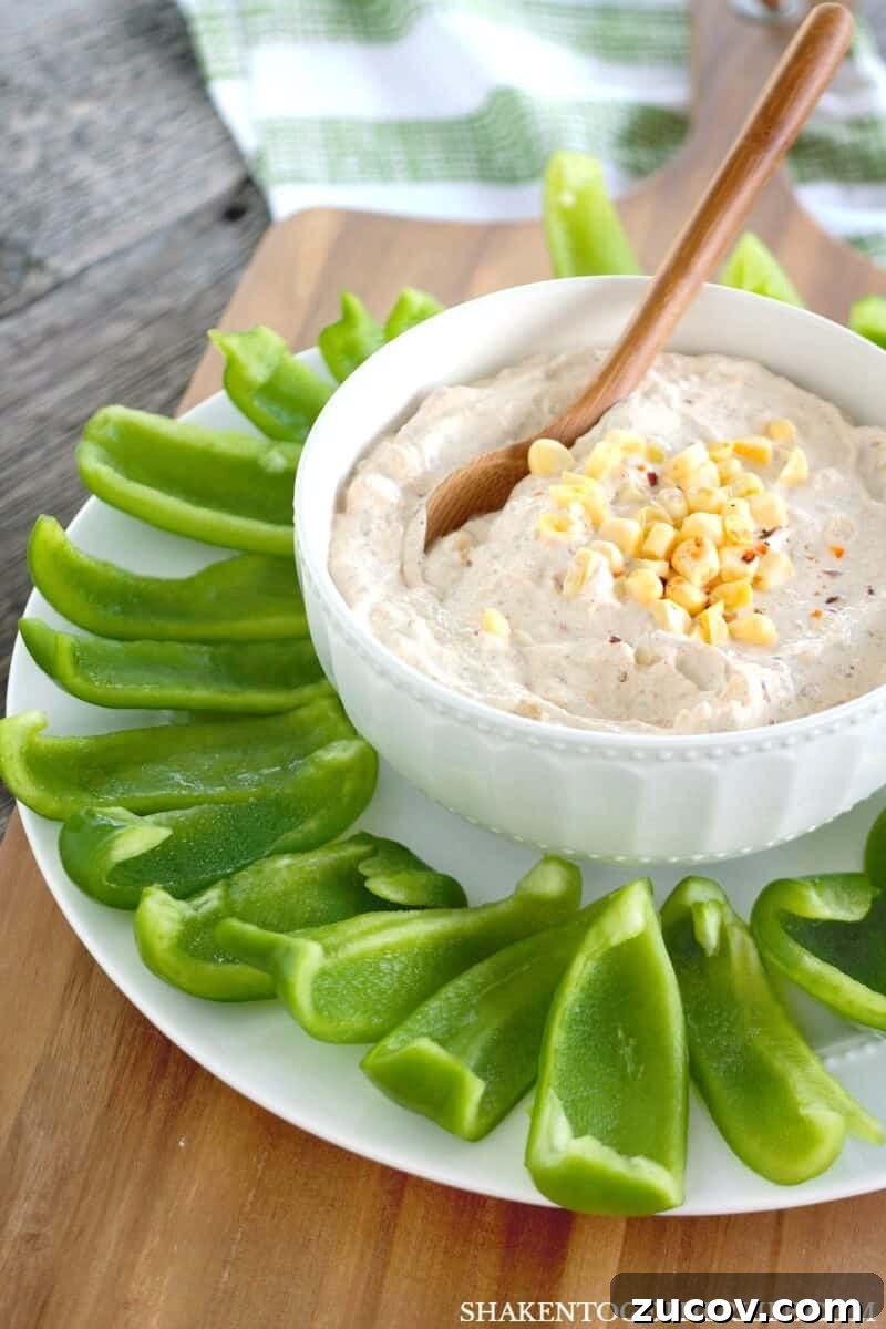 Creamy Chipotle Ranch Dip Recipe for Dipping & Spreading 4 Chipotle Ranch Dip in white bowl with Bell Pepper Chips on white plate