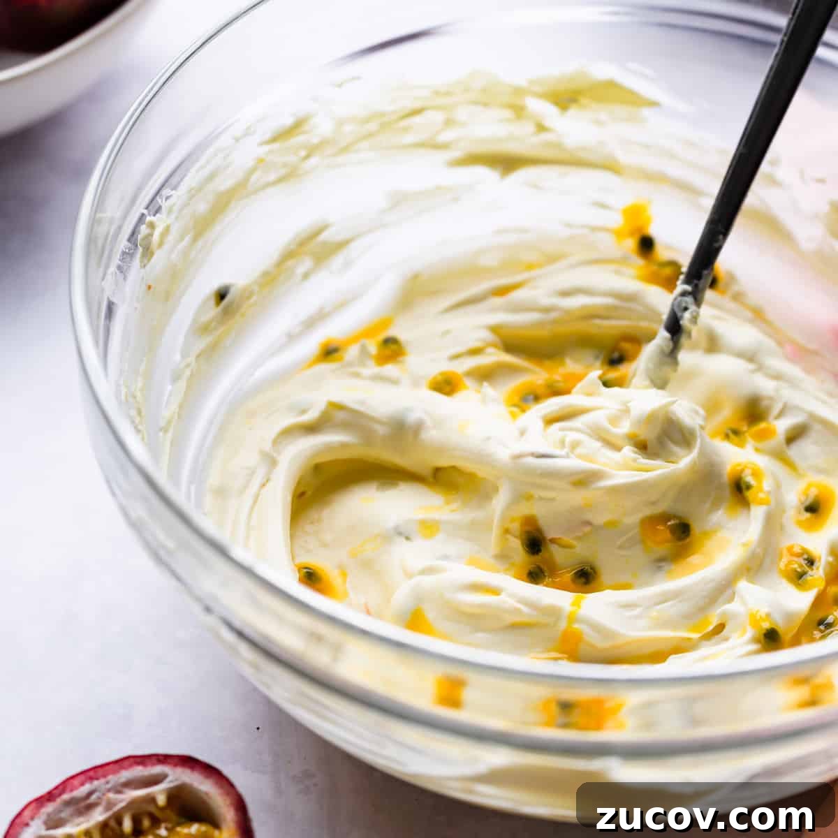 Zesty Lemon Mascarpone Tart Recipe for Creamy Citrus Dessert 4 bowl with whipped mascarpone cheese and passion fruit seeds.