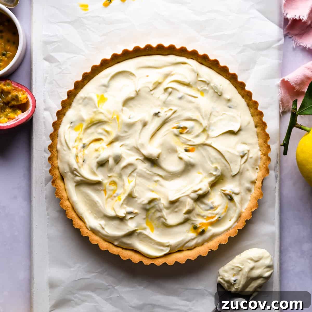 Zesty Lemon Mascarpone Tart Recipe for Creamy Citrus Dessert 5 sweet tart shell filled with mascarpone cheese mixed with some passion fruit.