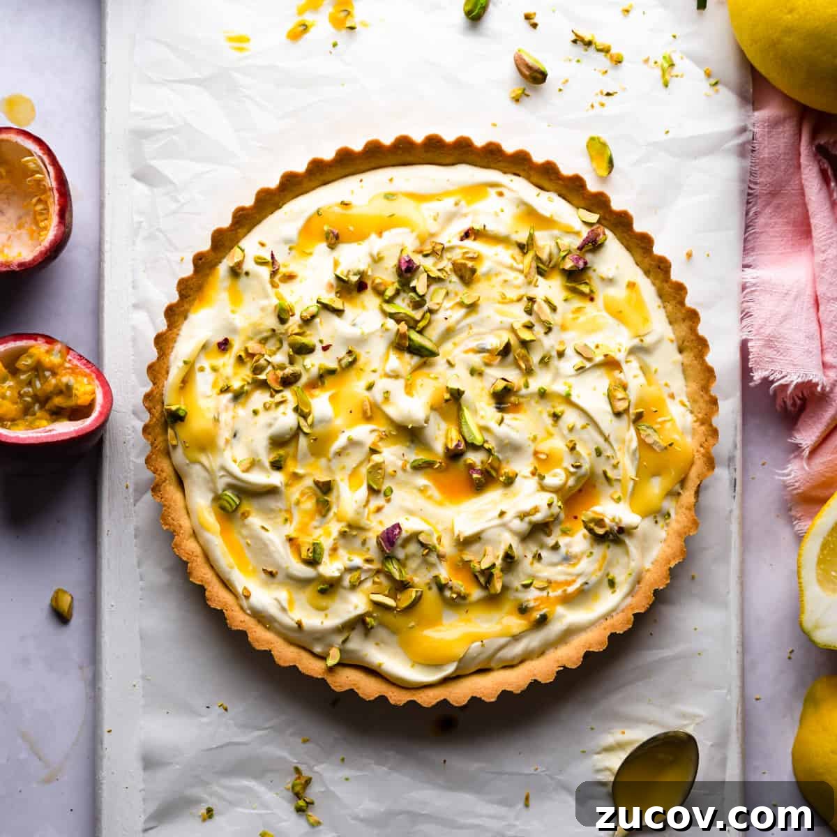 Zesty Lemon Mascarpone Tart Recipe for Creamy Citrus Dessert 7 lemon mascarpone tart topped with lemon curd and chopped pistachios.