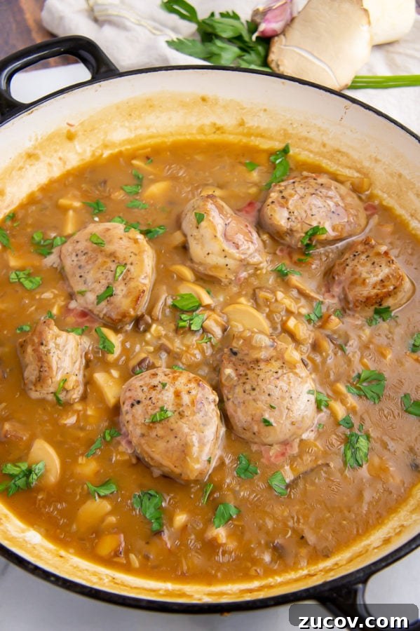 Juicy Pork Tenderloin with Creamy Mushroom Sauce Recipe 2 a pan of pork tenderloin medallions in a mushroom sauce