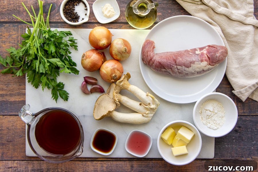Juicy Pork Tenderloin with Creamy Mushroom Sauce Recipe 3 ingredients on a white cutting board spread out