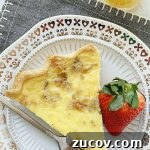 Classic Quiche Lorraine Recipe: Creamy Bacon and Gruyère Pie 9 overhead view of quiche slice on plate
