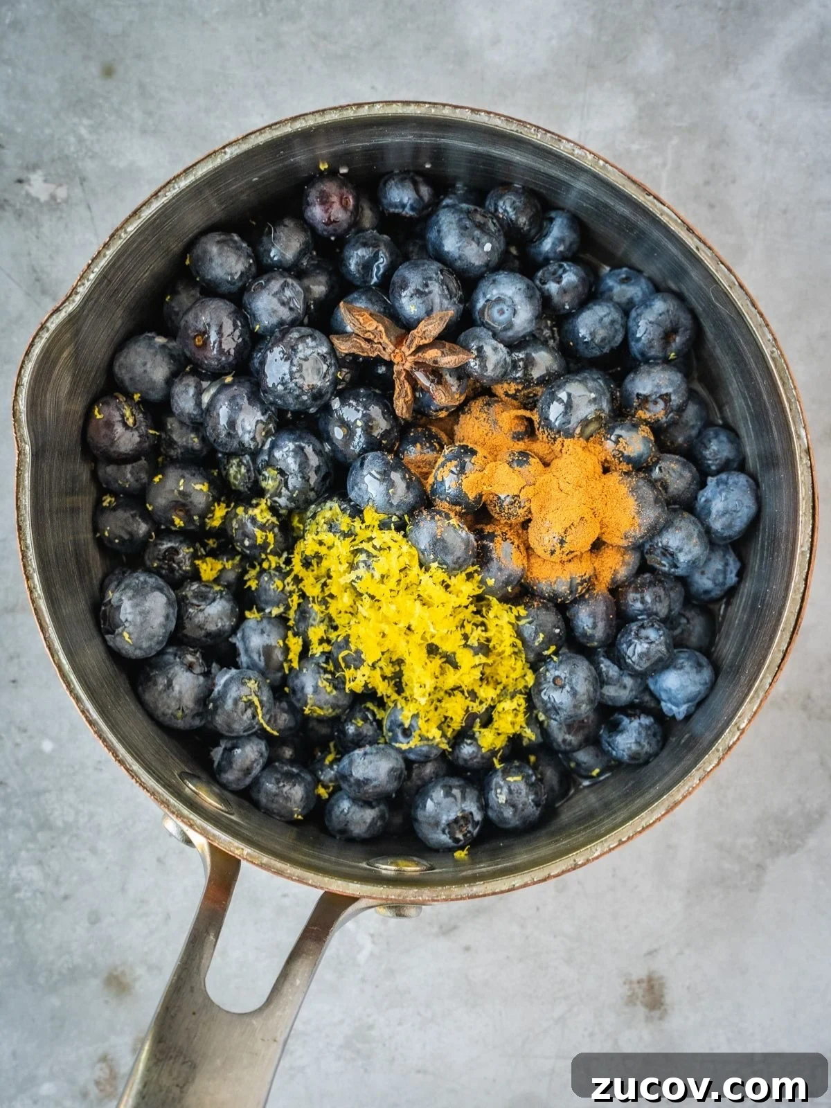 Maple Blueberry Compote Recipe for Pancakes and Yogurt 4 Blueberries, maple syrup, lemon zest, lemon juice, star anise, cinnamon and salt in a saucepan.