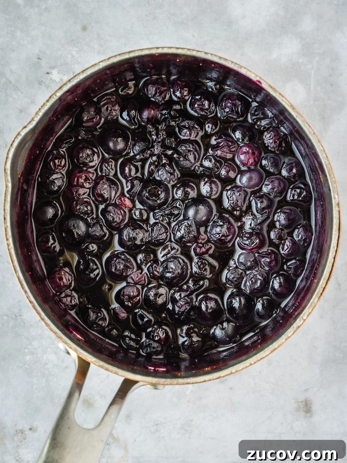 Maple Blueberry Compote Recipe for Pancakes and Yogurt 5 Blueberry Maple Compote in a saucepan.