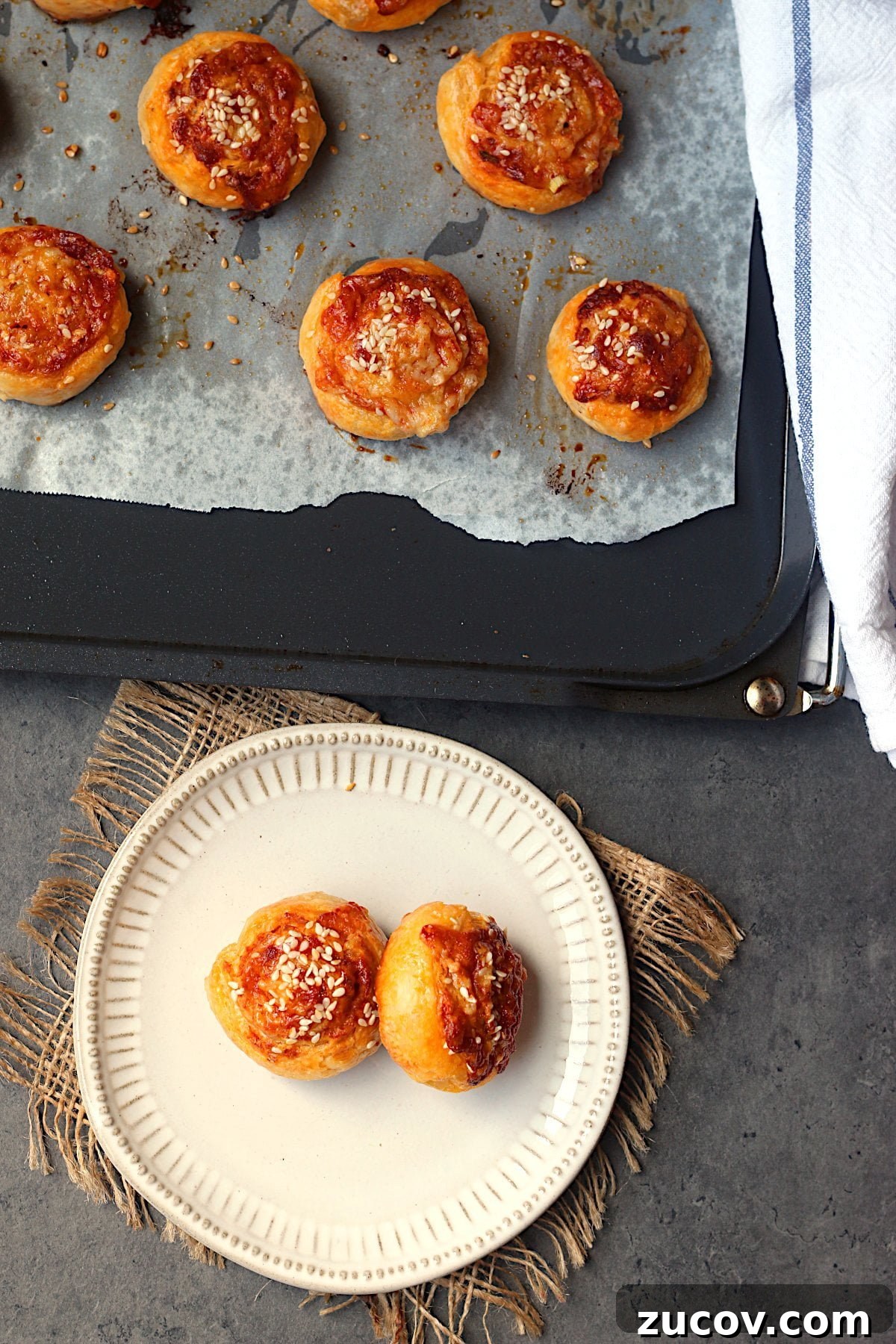 Gochujang Cheddar Pinwheel Appetizers: Spicy Korean Cheese Rolls 3 Overhead photo of homemade gochujang cheddar pinwheels.