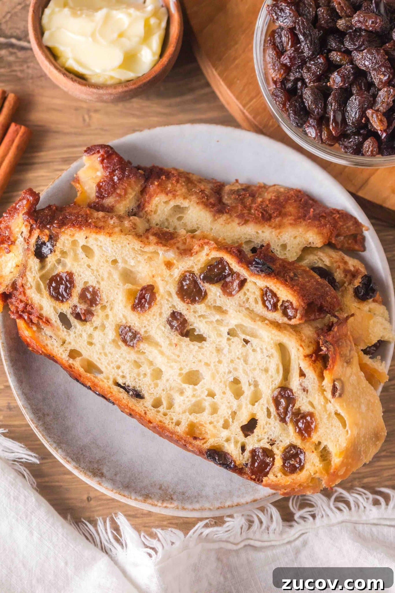 Sourdough Cinnamon Raisin Bread Recipe — Soft, Sweet & Spiced 17 Thick slices of sourdough cinnamon raisin bread on a plate. Hostess At Heart