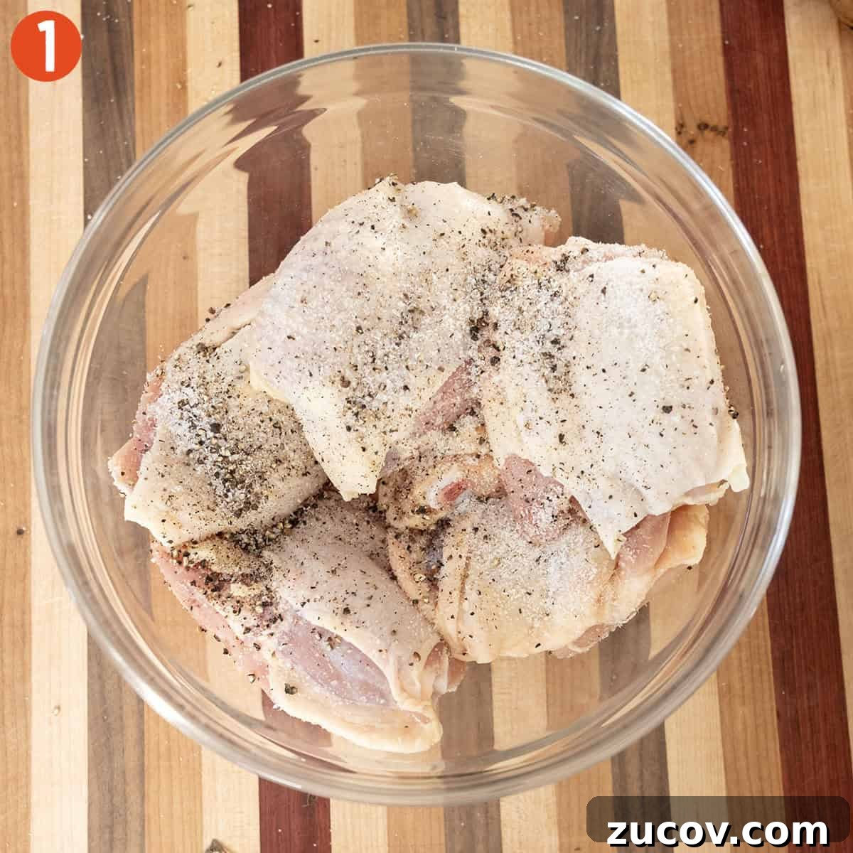 Classic Chicken Cacciatore Recipe: Rustic Italian Chicken Stew 4 Seasoned chicken thighs in a bowl.