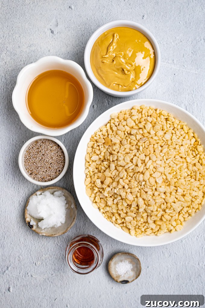 Rice Krispie Treats Without Marshmallows – Chewy Almond Butter Bars 3 Ingredients are in different bowls: rice cereal, honey, cashew butter, chia seeds, coconut oil, vanilla, and salt.