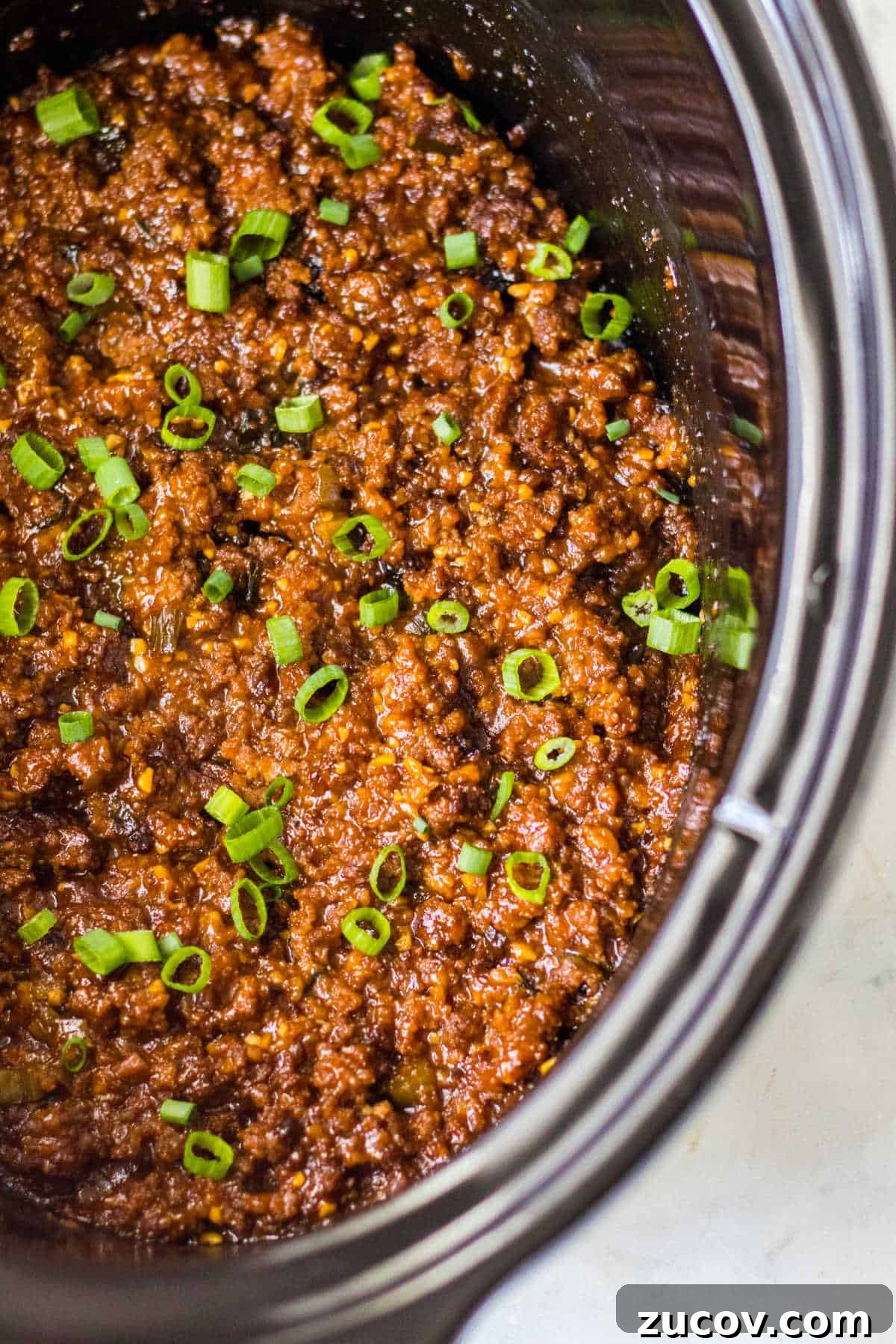 Korean-Style Sloppy Joes in the Slow Cooker: Tangy Gochujang Sandwiches 2 Korean sloppy joe meat in a slow cooker.