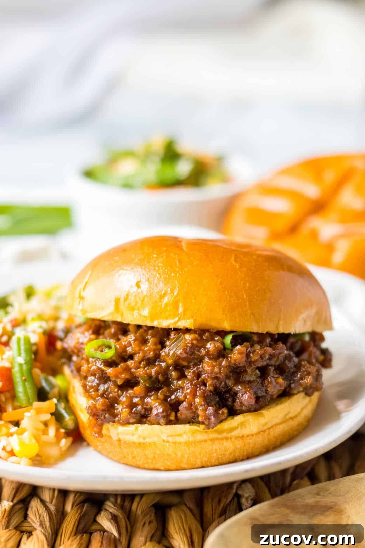 Korean-Style Sloppy Joes in the Slow Cooker: Tangy Gochujang Sandwiches 6 A Korean sloppy joe on a plate.