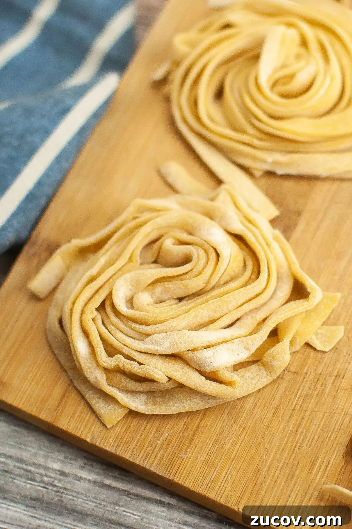 Homemade Gluten-Free Fettuccine Recipe for Perfect Pasta 2 Two small nests of gluten free fettuccine pasta.