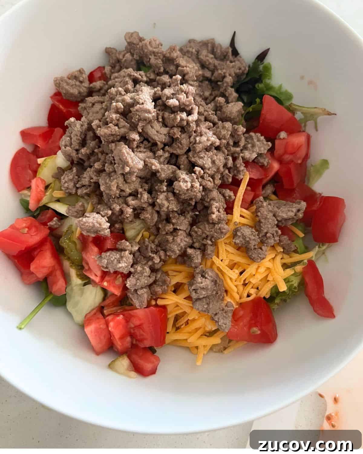 Big Mac Bowl Recipe: Classic Deconstructed Cheeseburger in Minutes 6 Ingredients for Big mac salad in a bowl.