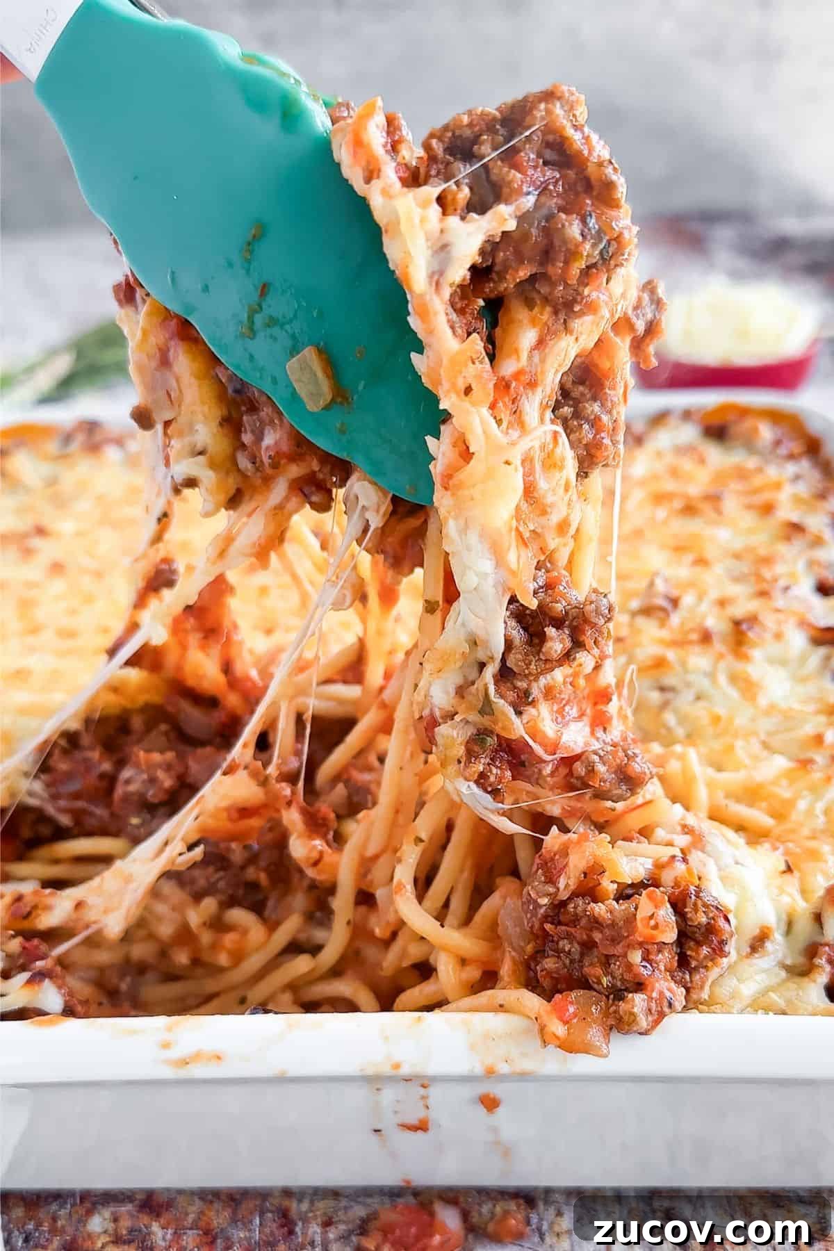 TikTok Spaghetti Recipe: Viral Creamy Pasta in 15 Minutes 8 Grabbing a spoonful of Tik Tok Spaghetti.