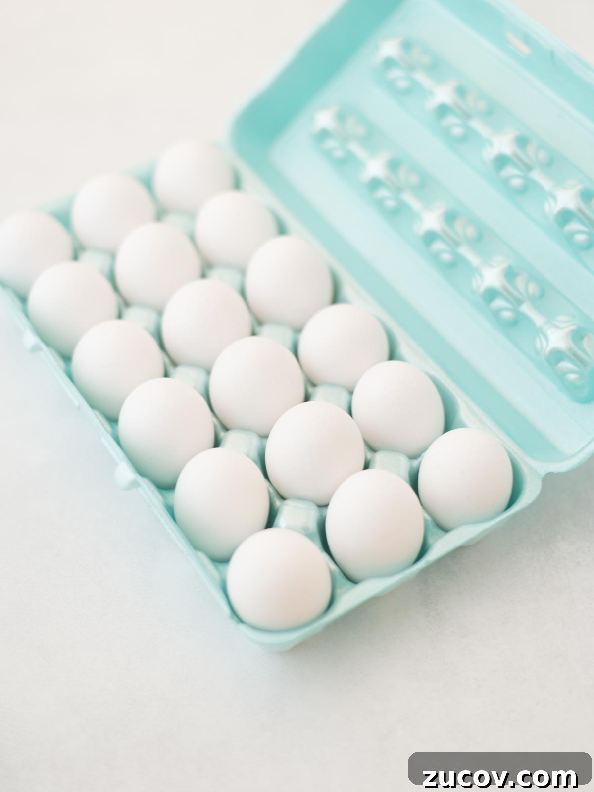 Perfect Hard-Boiled Eggs: Foolproof Method for Firm Whites & Creamy Yolks 3 Eggs in egg carton.